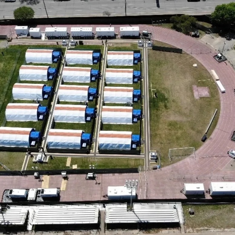Aerial view of mobile field hospital deployment with medical tents and support units